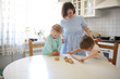 © natalialeb - Children brother and sister make cakes from dough