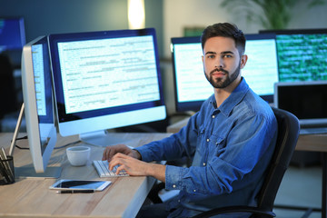 Male programmer working in office