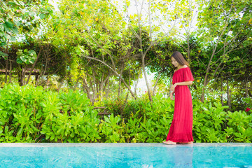 Portrait beautiful young asian woman relax leisure in swimming pool at hotel and resort