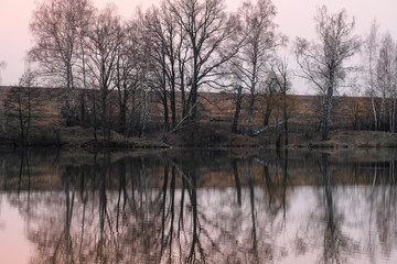  Landscape with the image of spring lake at sunset