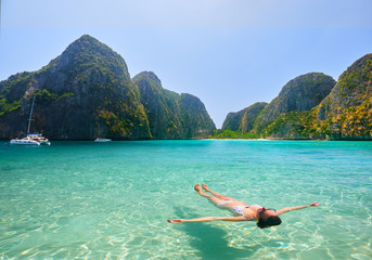 Canvas Print - Happy young woman enjoying swimming in refreshing sea water Phi Phi Island, Thailand