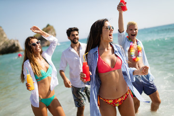 Group of happy people having fun at summer. Beach vacation friends travel concept