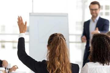 Wall Mural - Training participant raise hand ask question at employees team workshop