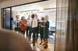 © Flamingo Images - Diverse business team brainstorming with sticky notes in an offi