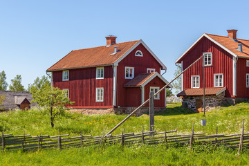 Wall Mural - Old farm houses in the countryside in Sweden