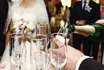 Wall Mural - celebrating and toasting happy group of people with champagne at the  wedding reception