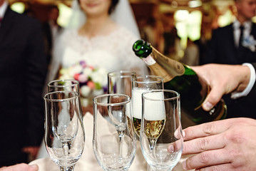 Wall Mural - celebrating and toasting happy group of people with champagne at the  wedding reception