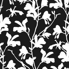 Seamless pattern with magnolia tree blossom in black and white. Floral background with branch and magnolia flower. Spring design with big floral outline elements. Hand drawn botanical illustration.