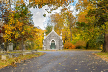 Small Mausoleum At Sleepy Hollow Cemetery, Surrounded By Autumnal Fall Foliage, Upstate New York, NY, USA