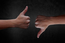 Hand Dislike Sign, Giving Thumb Up And Thump Down For Defeated On Black Background.