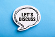 Let Us Discuss Speech Bubble Isolated On Blue Background