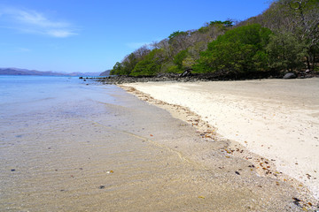 Wall Mural - View of the black sand volcanic Playa Sombrero Obscuro beach in Peninsula Papagayo in Guanacaste, Costa Rica