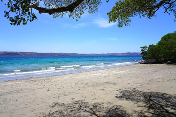 Wall Mural - View of the black sand volcanic Playa Sombrero Obscuro beach in Peninsula Papagayo in Guanacaste, Costa Rica