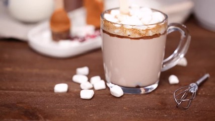 Sticker - Salted caramel hot cocoa spoon in glass cup.