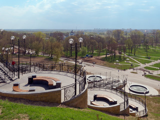 Wall Mural - MOGILEV, BELARUS - APRIL 27, 2019: park area with a staircase and a fountain.