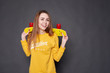 © Kiryl Lis - Portrait of positive young attractive girl wearing yellow blouse and blue jeans holding yellow skateboard.
