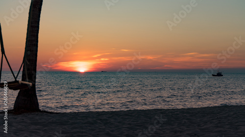 Swing On The Beautiful Beach With Beautiful Orange Sunset With