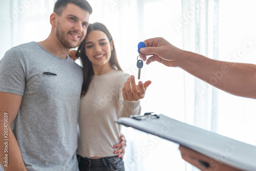 Happy Couple Receiving Apartment Key From Real Estate Agent Realtor Young Happy Couple Smiling And Getting Keys From New Real Estate From Agent Stock Photo Adobe Stock Happy Couple Receiving Apartment Key From Real Estate Agent Realtor Young Happy Couple Smiling And Getting Keys From New Real Estate From Agent Stock Photo Adobe Stock
