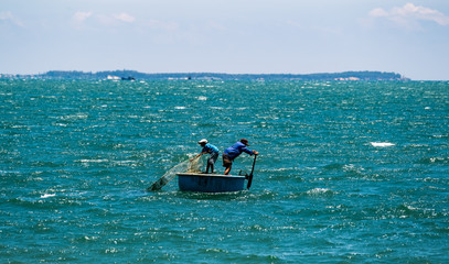 people in the fishing bowl boats in the sea