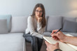© Dragana Gordic - Psychologist listening to woman in trouble during therapy session. Psychotherapist understanding problems of a woman patient. Cropped image of depressed man at the psychotherapist.