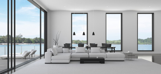 view of white living room in minimal style with black and white furniture on dark laminate floor.int