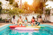 © Alessandro Biascioli - Group of happy friends relaxing in swimming pool - Young people having fun in exclusive summer tropical vacation - Friendship, holidays and youth lifestyle concept