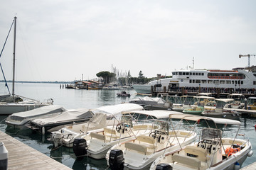 Wall Mural - Desenzano, Italy - 04.22.2019: Day after Easter in Desenzano City on the shore of the lake.