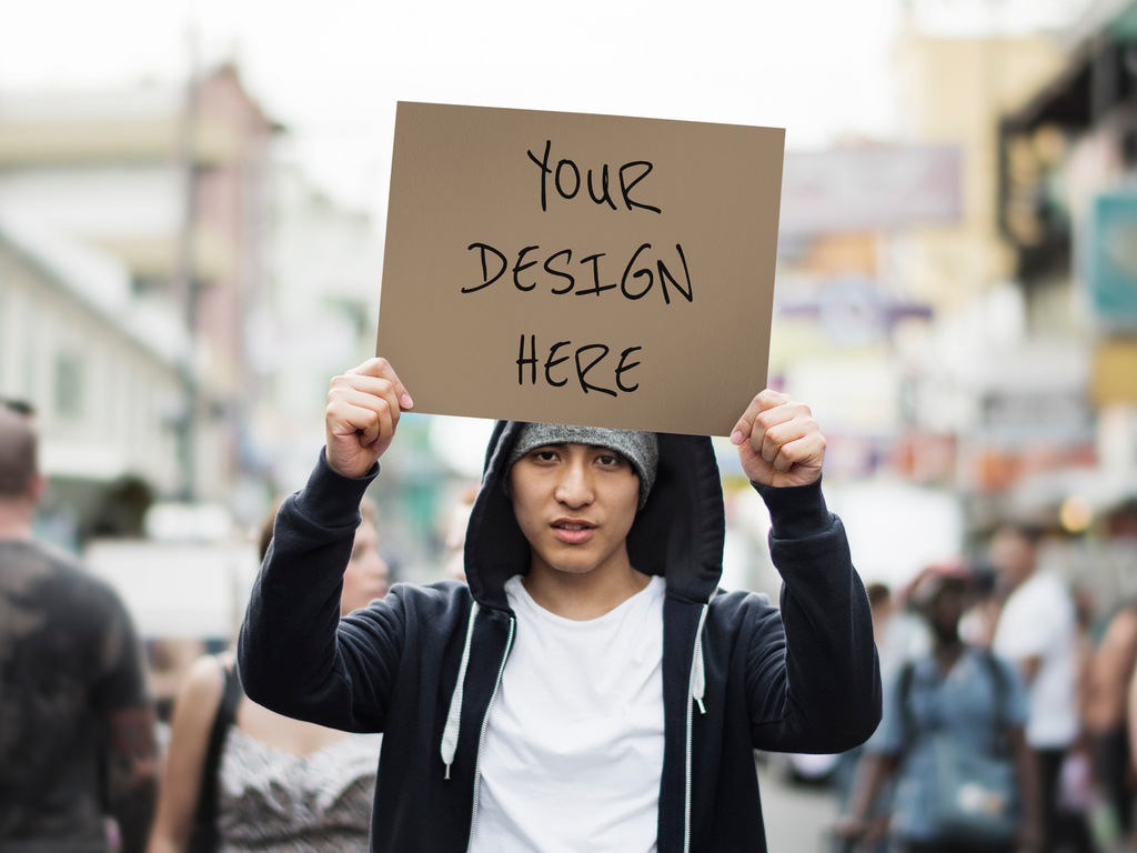 Person Holding Poster Mockup on the Street Stock Template | Adobe Stock