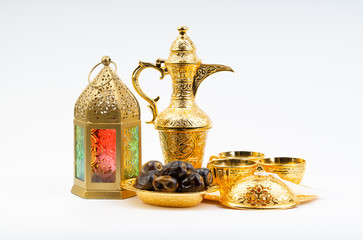 Wall Mural - Premium dates, lantern and arabic coffee set on white background. Selective focus, copy space and Ramadan Kareem concept