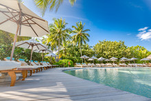 Luxury Swimming Pool In The Tropical Hotel Or Resort. Palm Trees And Infinity Pool Close To Lounge Chairs And Umbrellas. Exotic Travel Destination, Summer Mood, Beach Holiday