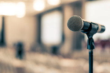 Wall Mural - Microphone voice speaker in business seminar, speech presentation, town hall meeting, lecture hall or conference room in corporate or community event for host or public hearing