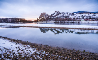 Wall Mural - Snow Covered Devin Castle Ruins above the Danube River in Bratislava, Slovakia in the Morning