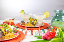 Margaritas With Salt And Limes And Mexican Food