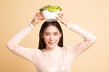 Healthy Asian woman with salad.