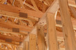 © Mint Images - Low angle view of ceiling beams in new house