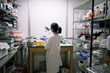 © Mint Images - Asian scientist examining fluid in beaker