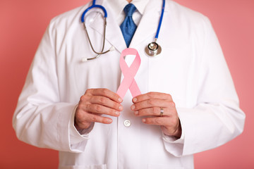 Wall Mural - Doctor Holding Breast Cancer Awareness Ribbon