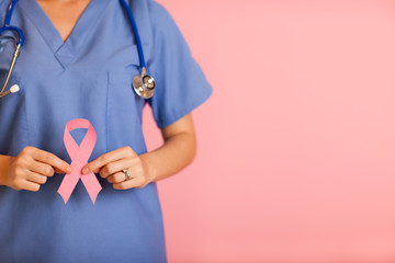 Wall Mural - Nurse Holding Breast Cancer Awareness Ribbon