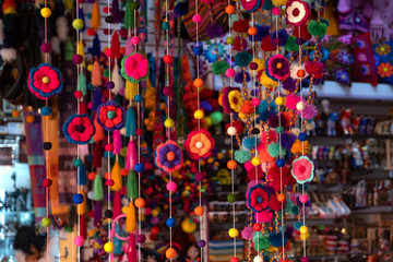 Colorful peruvian and andean handmade (handcraft) textile and woolen goods with traditional design for sale at Indian Market Miraflores, Lima