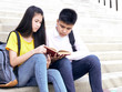 © jittima - Happy Students Outdoor With Books