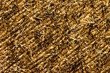 Abstract textured background of gold and black Christmas tinsel