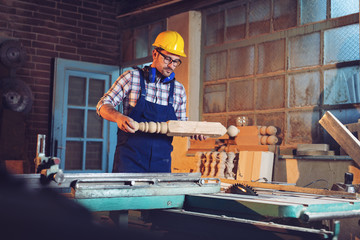 Canvas Print - Portrait of a professional carpenter in his workshop 