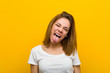 © Asier - Young natural caucasian woman funny and friendly sticking out her tongue.