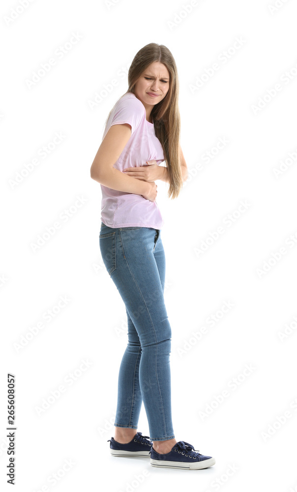 Young woman suffering from abdominal pain on white background