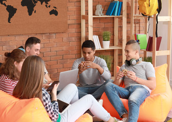 Wall Mural - Group of teenagers spending time at home