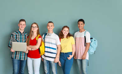 Canvas Print - Group of teenagers on color background