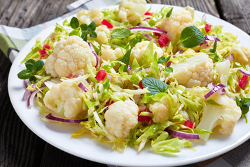 Wall Mural - close-up of healthy cauliflower salad, top view