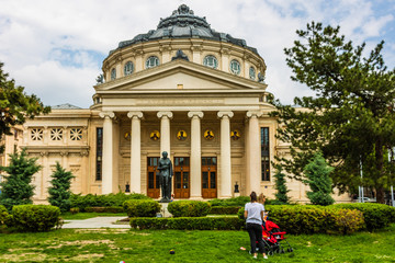 Wall Mural - Bucharest, Romania - 2019.  People in front of the Romanian Athenaeum in the center of Bucharest, a landmark of the Romanian capital city.