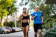 © Martinan - Healthy young couple jogging outdoors