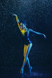 © master1305 - Young female ballet dancer performing under water drops and spray. Caucasian model dancing in neon lights. Attractive woman. Ballet and contemporary choreography concept. Creative art photo.